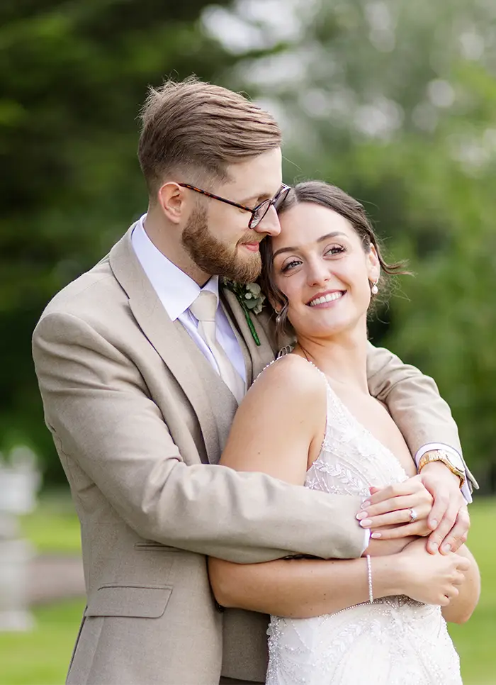 bride and groom hugging