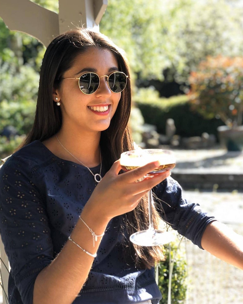 Wedding photographer enjoying cocktail during outdoor break