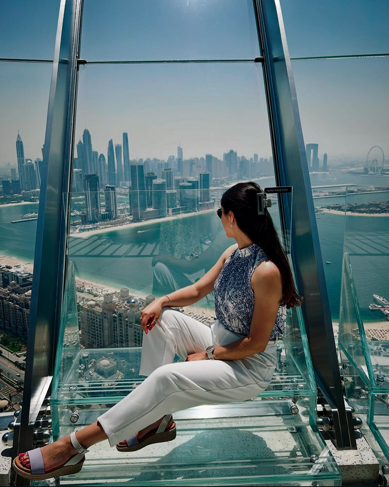Wedding photographer overlooking city skyline from observation deck