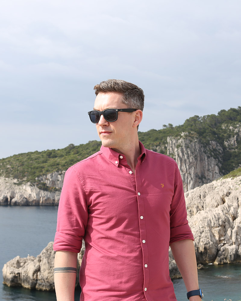 Wedding videographer enjoying coastal view during travels