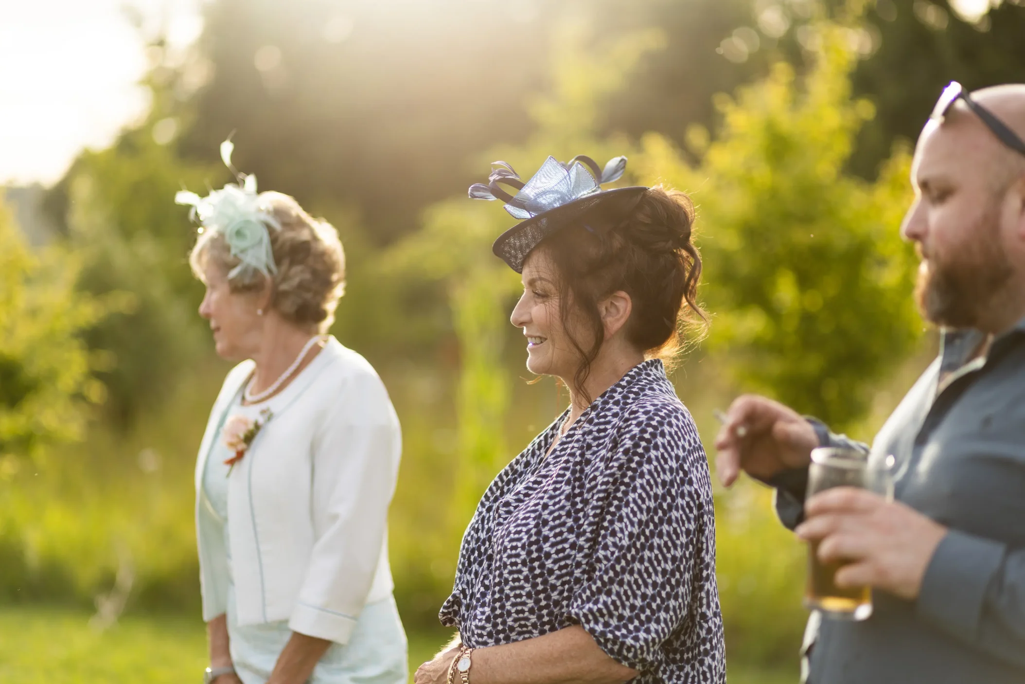 uests mingling at a summer wedding enjoying the relaxed atmosphere filmed in wedding videography.