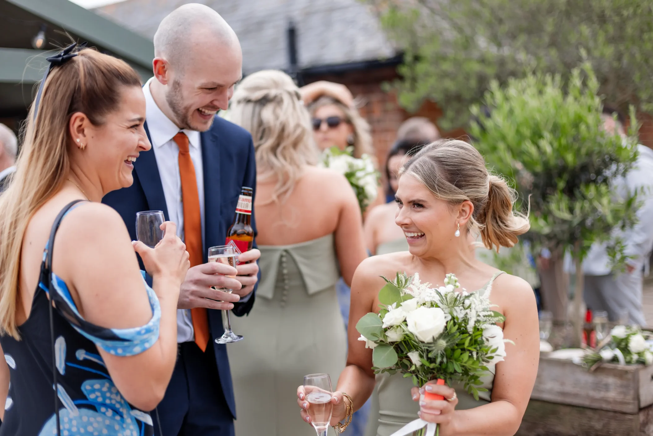 The groom and guests toasting during the wedding reception celebrations filmed in wedding videography.